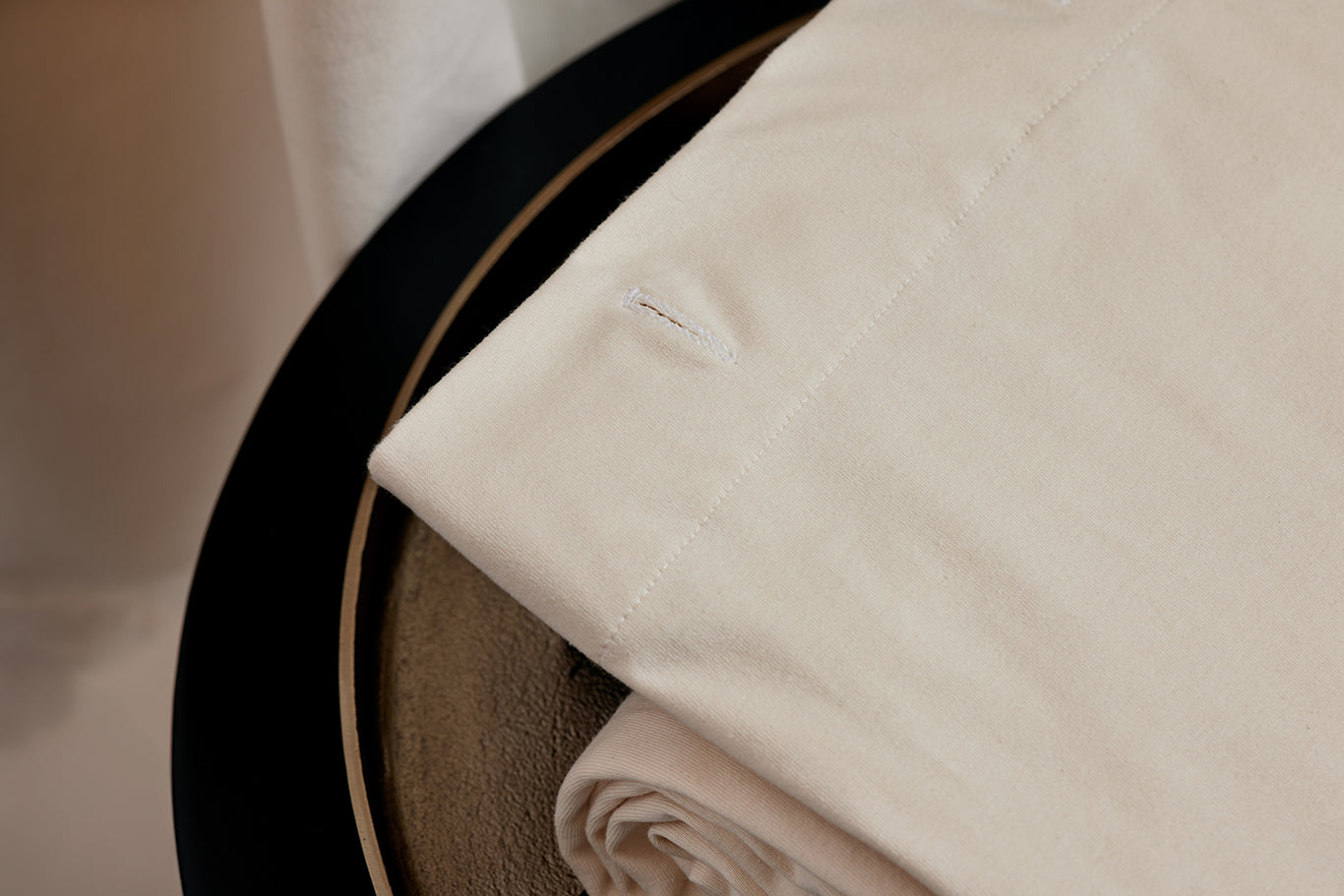 Close-up of The Loving Liner folded in a spa-like background.