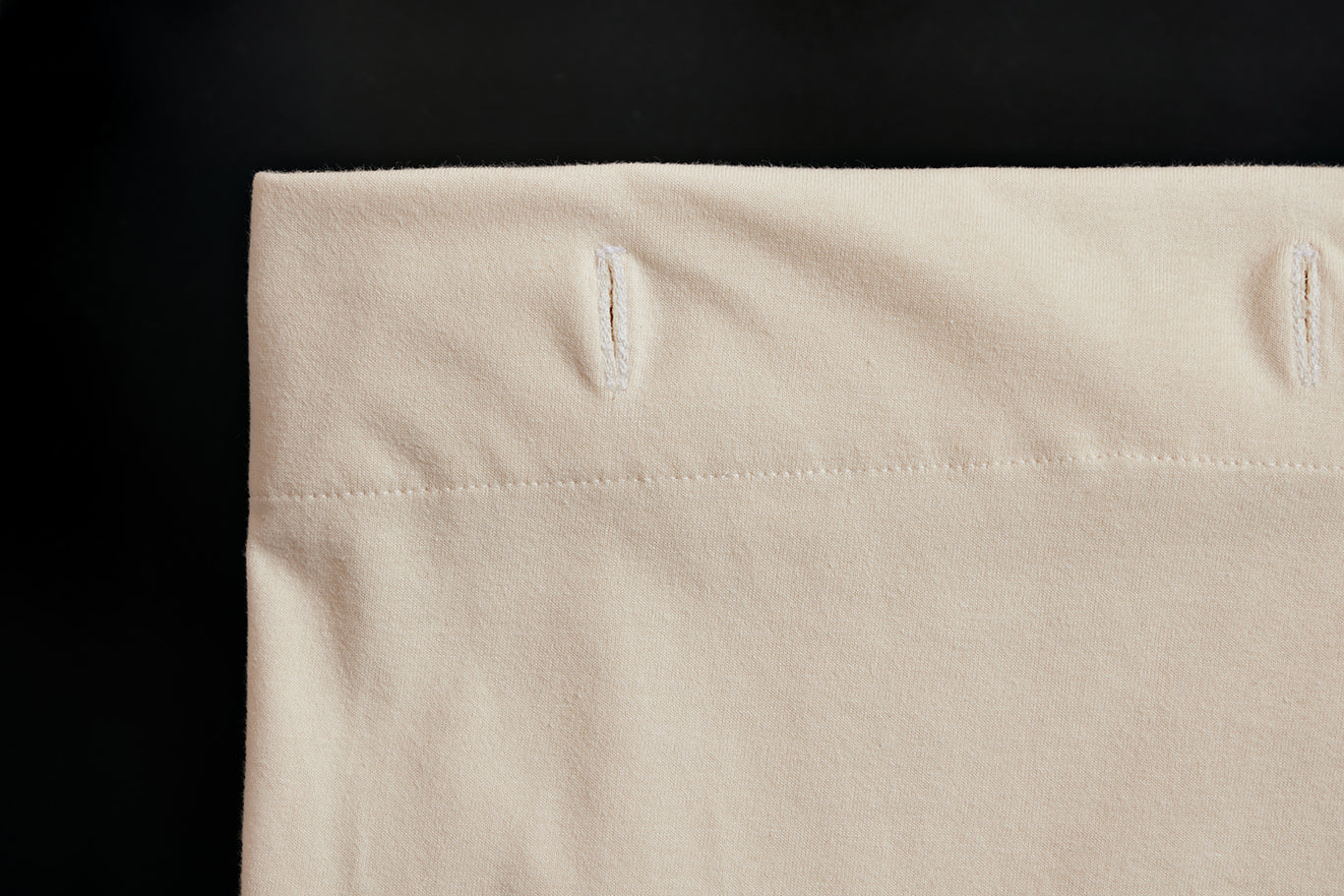 Close up of the button detail on The Loving Liner.